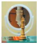 figura de um objeto e sua imagem refletida em um espelho esférico